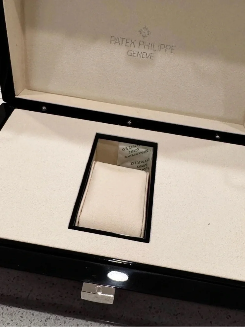 Patek Philippe Brown and Black High-Gloss Wood Watch Box with Silver Emblem